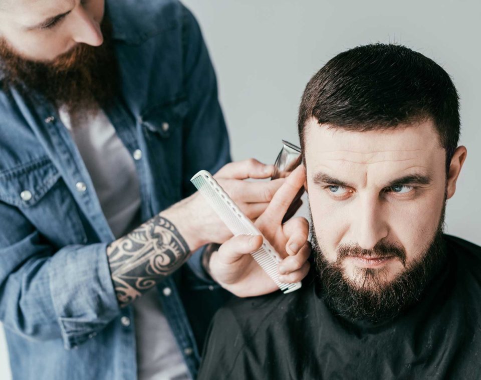barber-shaving-customer-hair-with-shaving-machine-2022-12-16-18-01-42-utc