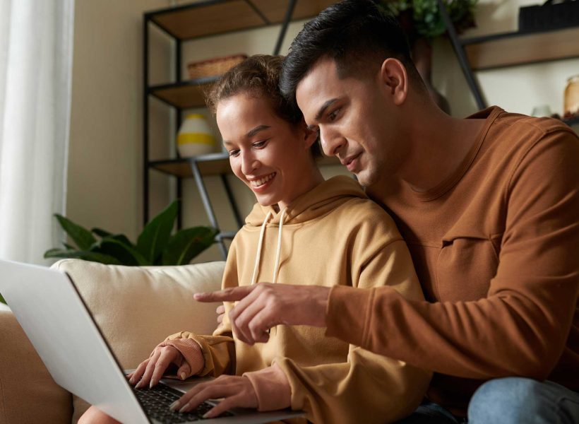 couple-using-laptop-together-at-home-2022-02-28-21-47-44-utc
