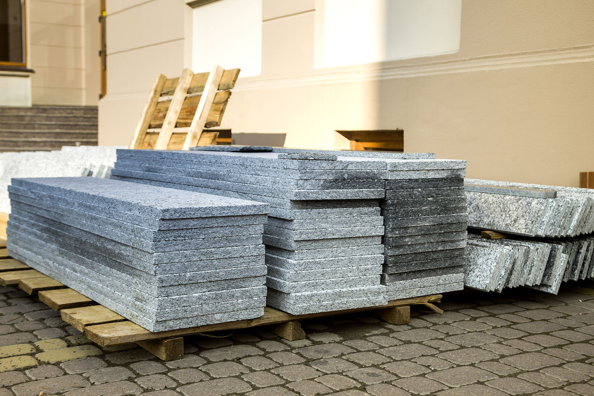 piles-of-granite-marble-slabs-stone-sheets-for-de-2022-03-16-00-15-09-utc