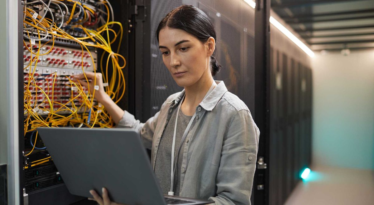 female-network-technician-inspecting-servers-in-da-2022-02-01-22-36-30-utc