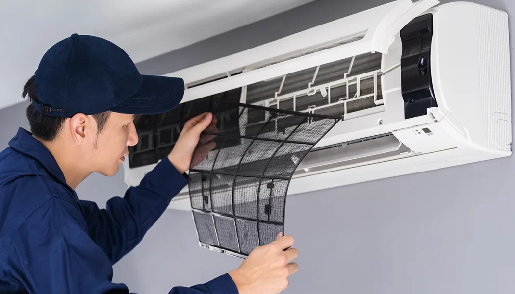 technician-service-removing-air-filter-air-conditioner-cleaning (1)