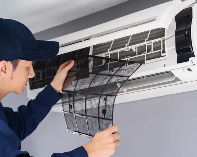 technician-service-removing-air-filter-air-conditioner-cleaning