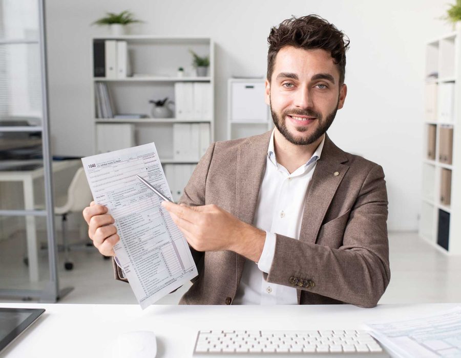 accountant-pointing-at-tax-form-2023-11-27-04-51-47-utc