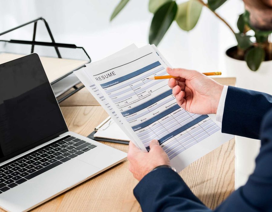selective-focus-of-man-holding-resume-and-pencil-n-2023-11-27-05-09-38-utc