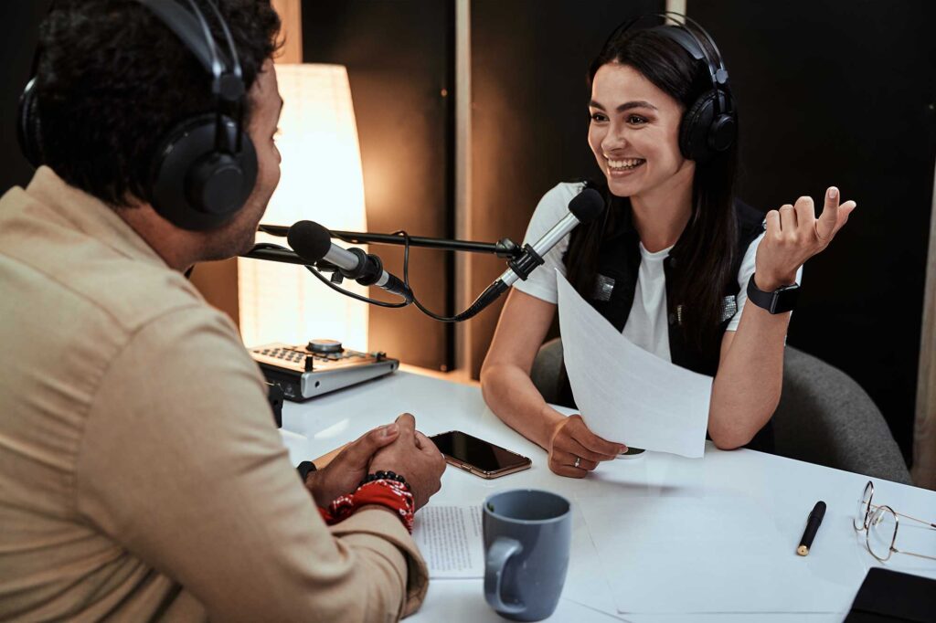 portait-of-happy-female-radio-host-smiling-talkin-2022-09-28-23-30-18-utc