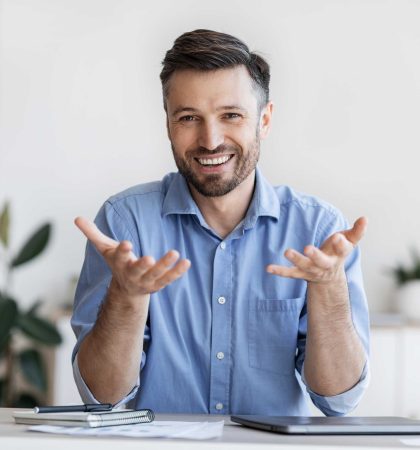 successful-handsome-businessman-sitting-at-desk-in-2022-12-16-07-48-48-utc-(2)