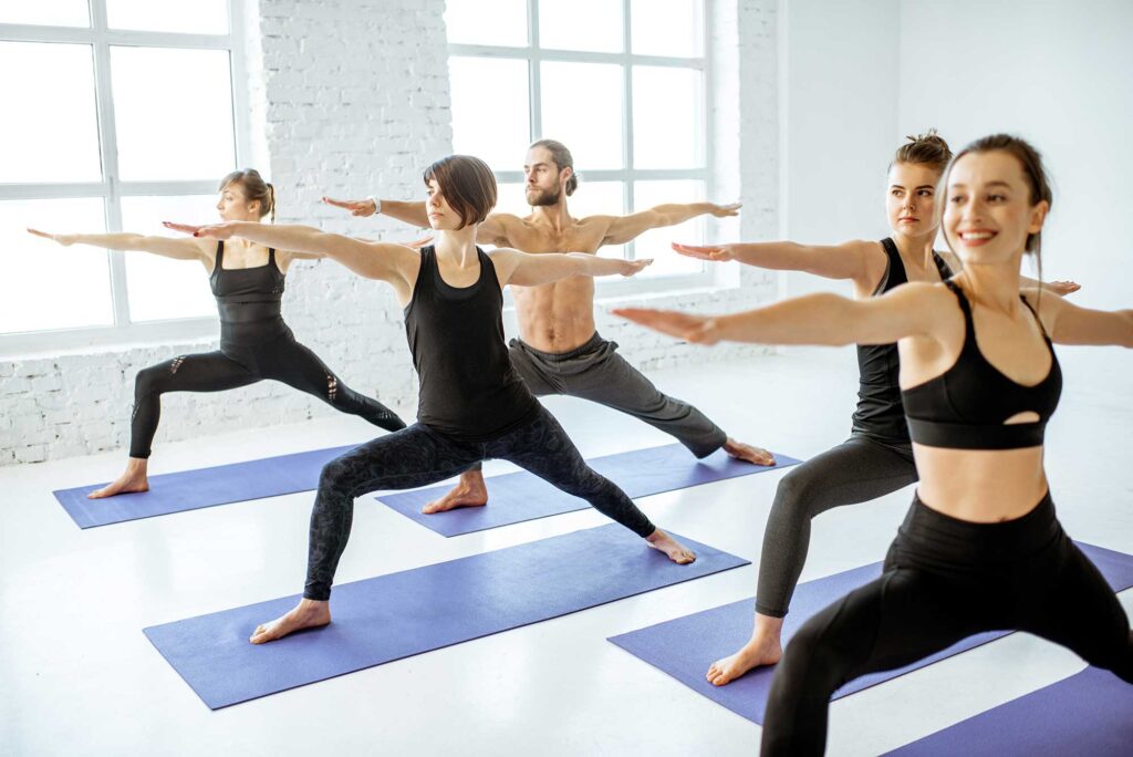 group-of-people-practising-yoga-indoors-2022-01-19-00-17-56-utc